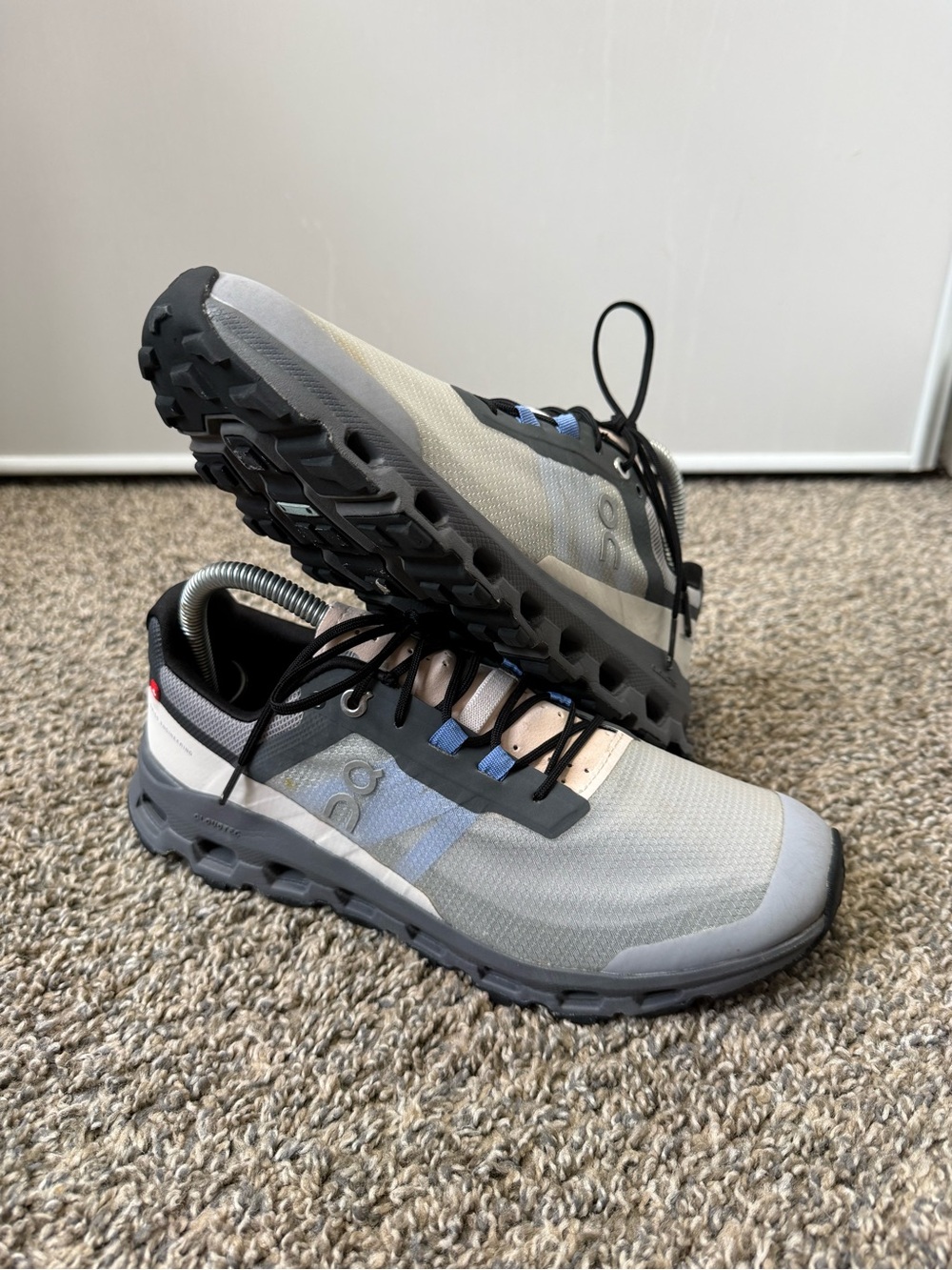 On Running Trail Shoes in Light Gray with Blue Accents